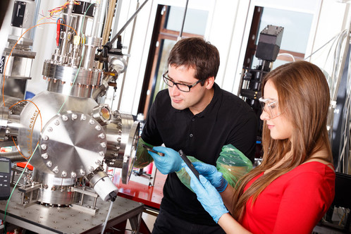 Physics Research scientist looking to the laser deposition chamber